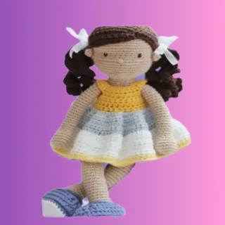 Crochet doll with curly pigtails, removable dress, shoes and hair bows