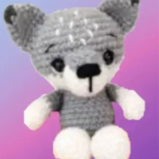 Crocheted Wilson the Wolf woodland critter with gray and white coloring