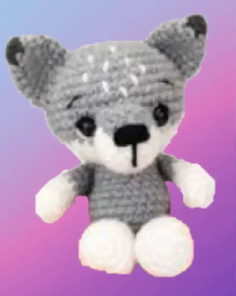 Crocheted Wilson the Wolf woodland critter with gray and white coloring